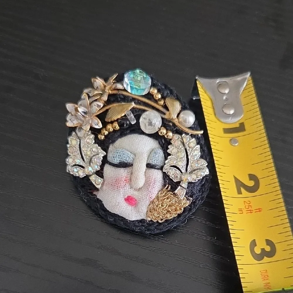Artistic Face Brooch with Gold and Black Accents